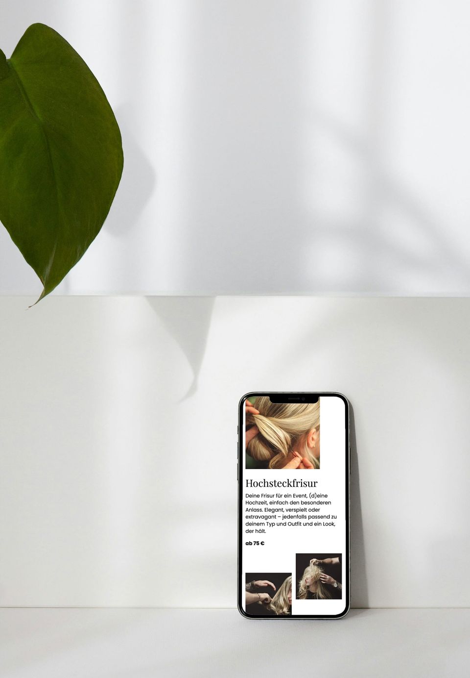 Smartphone mit der mobilen Ansicht von Michael's Friseur